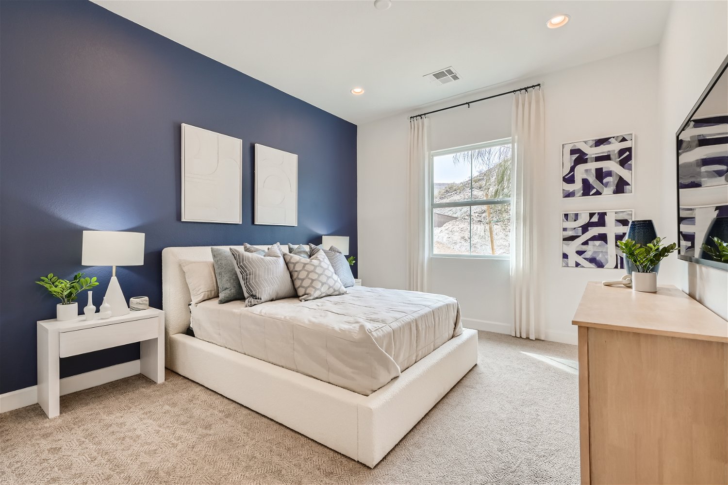 A room with a bed and a window.