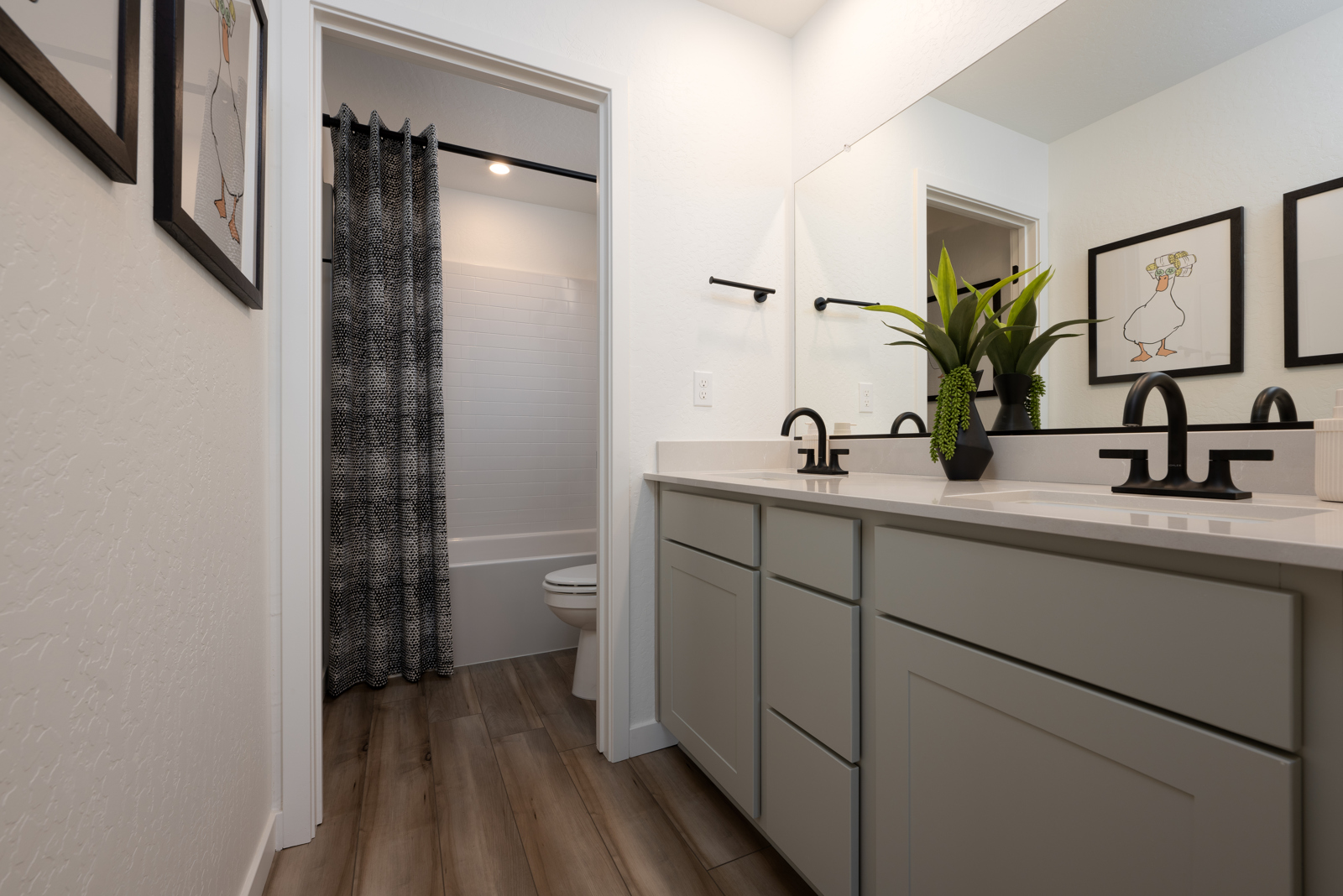 A bathroom with a sink and a toilet.