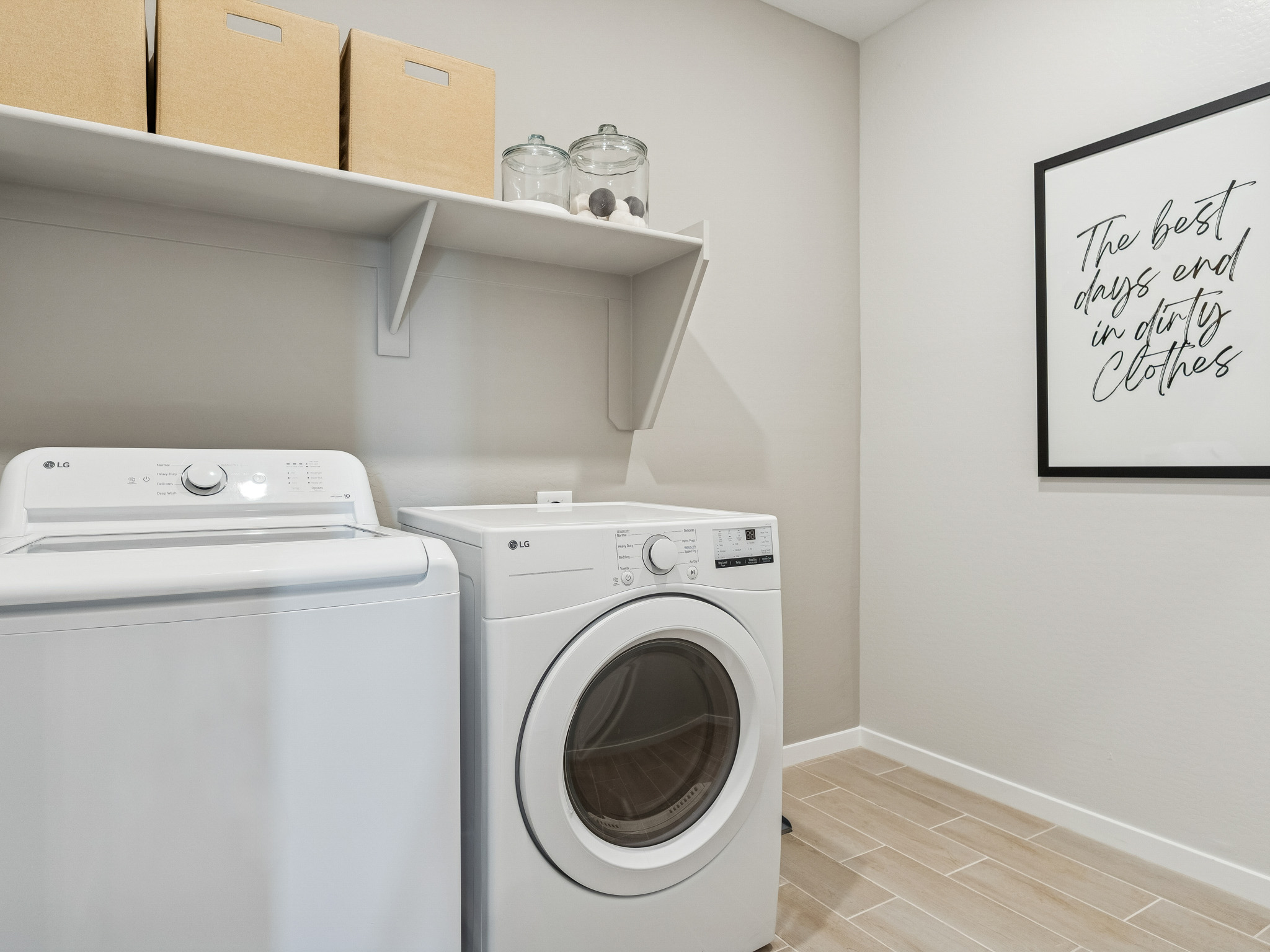 A washing machine and dryer in a room.