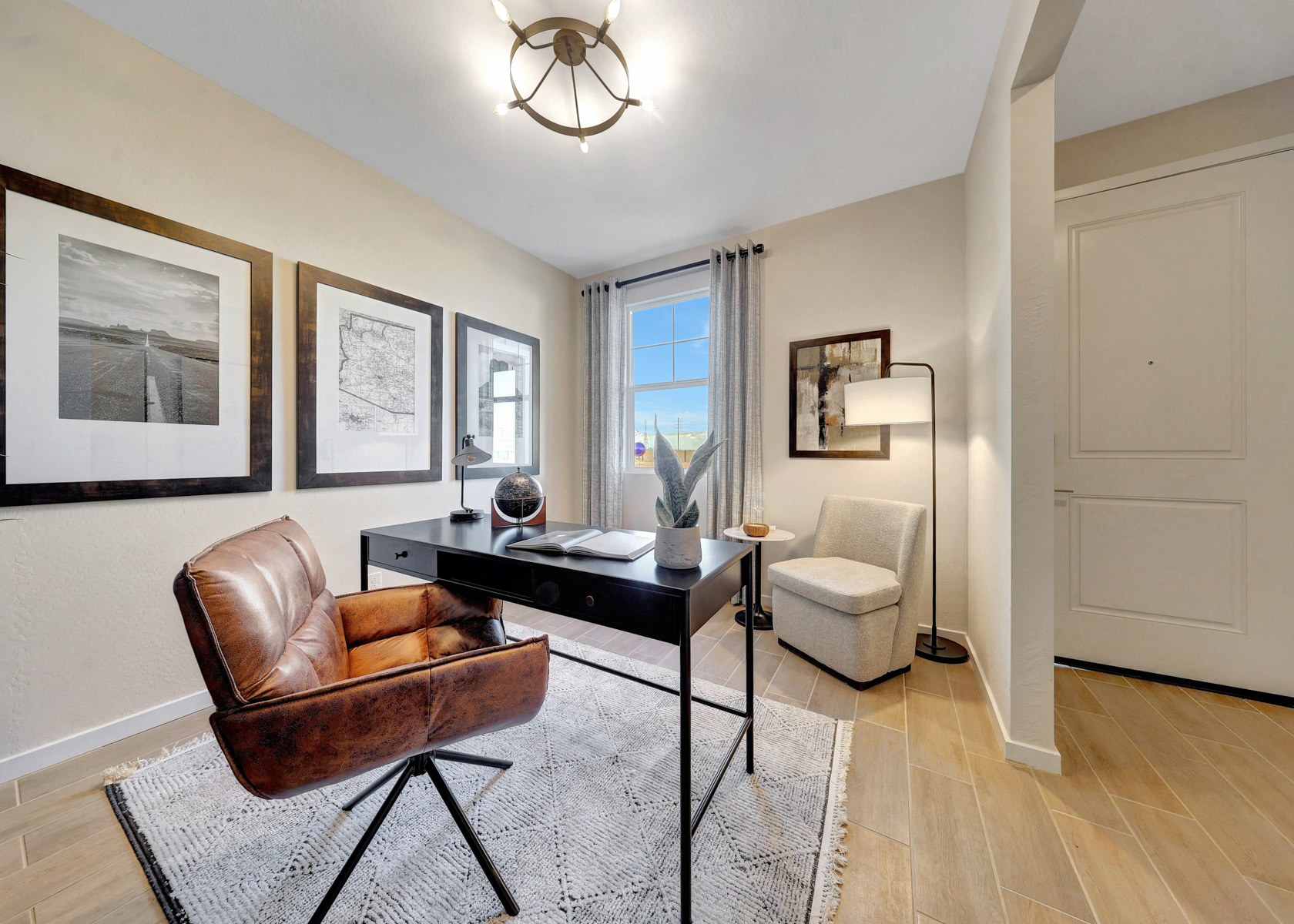 A living room with a table and chairs.