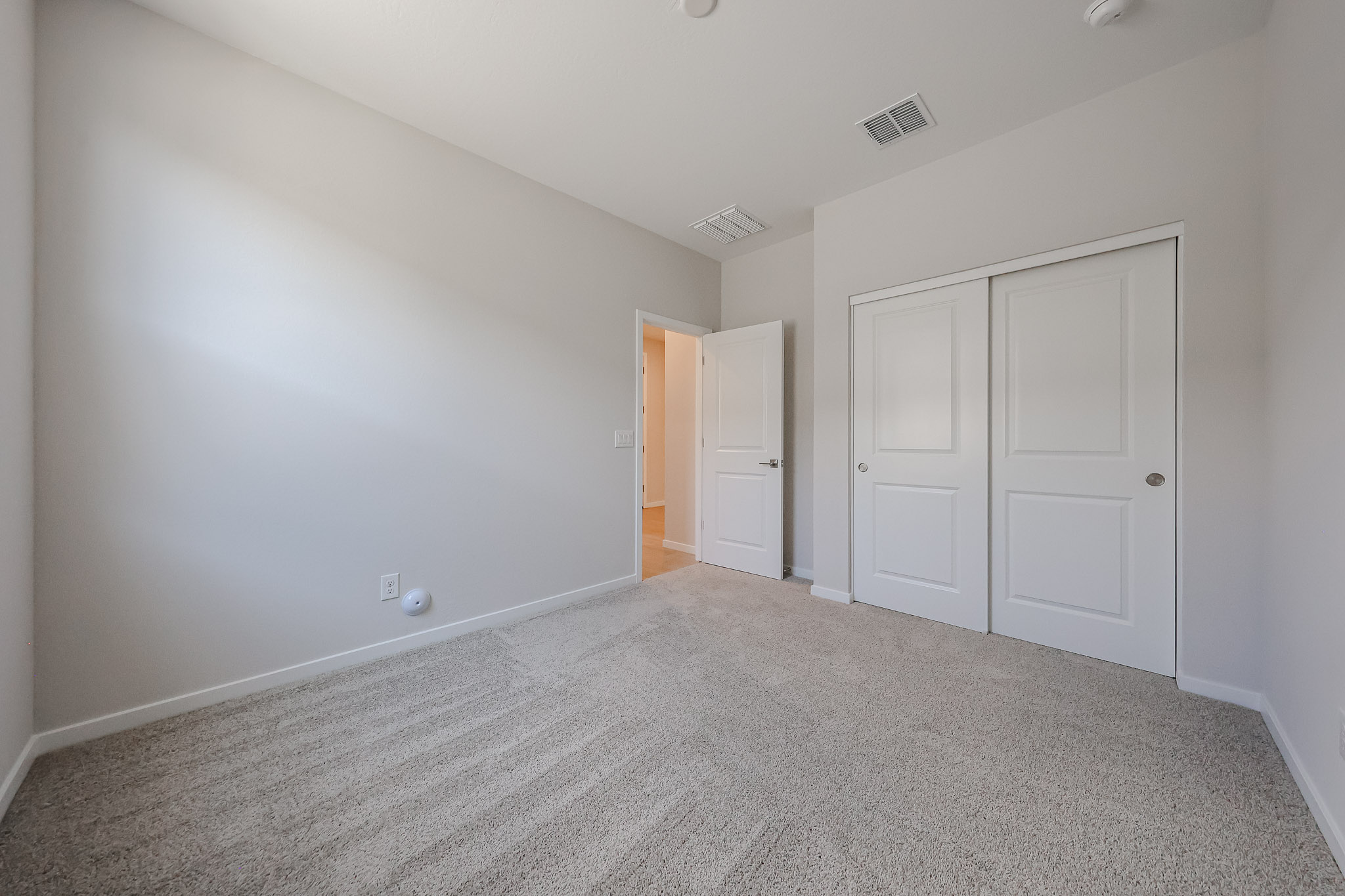 A room with white doors.