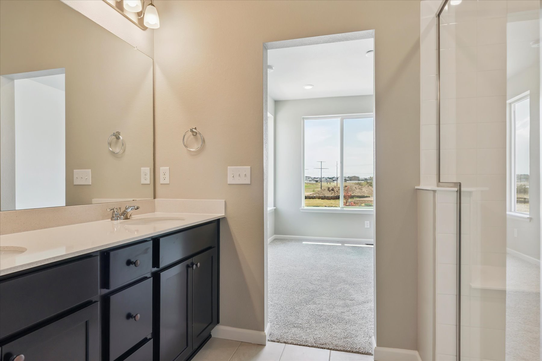 A bathroom with a glass door.