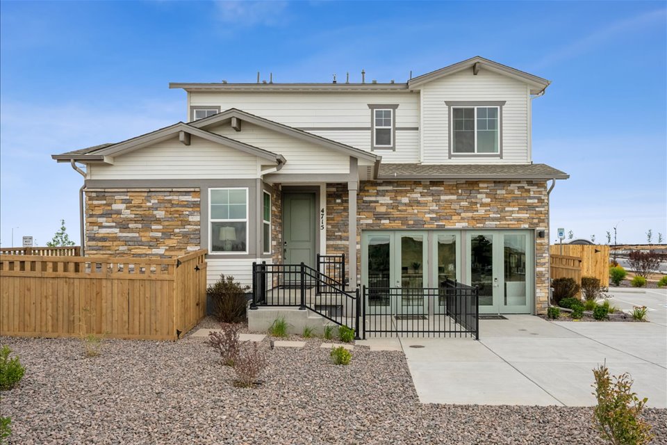 A house with a fence and a gate.