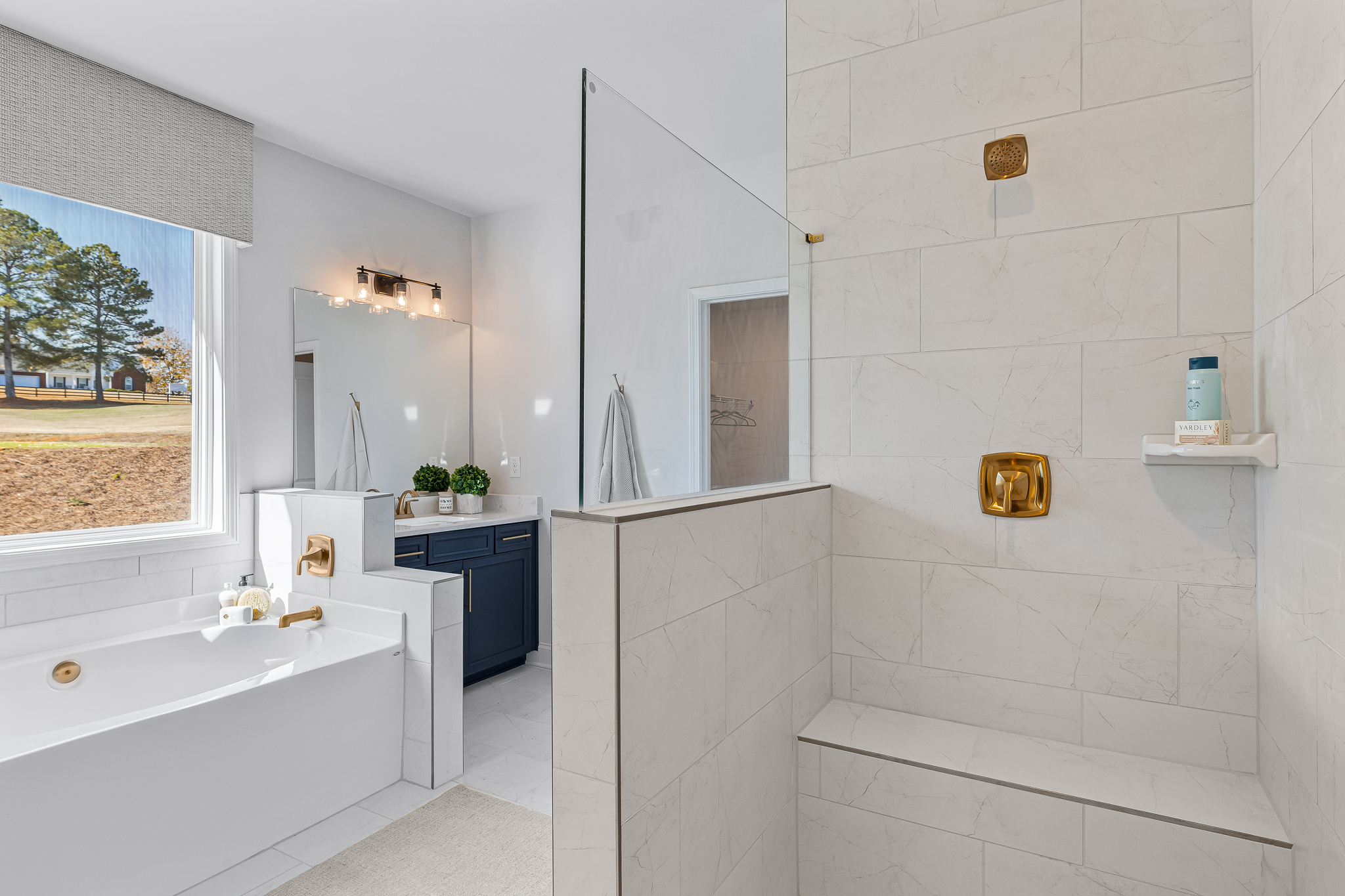 A bathroom with a tub and sink.