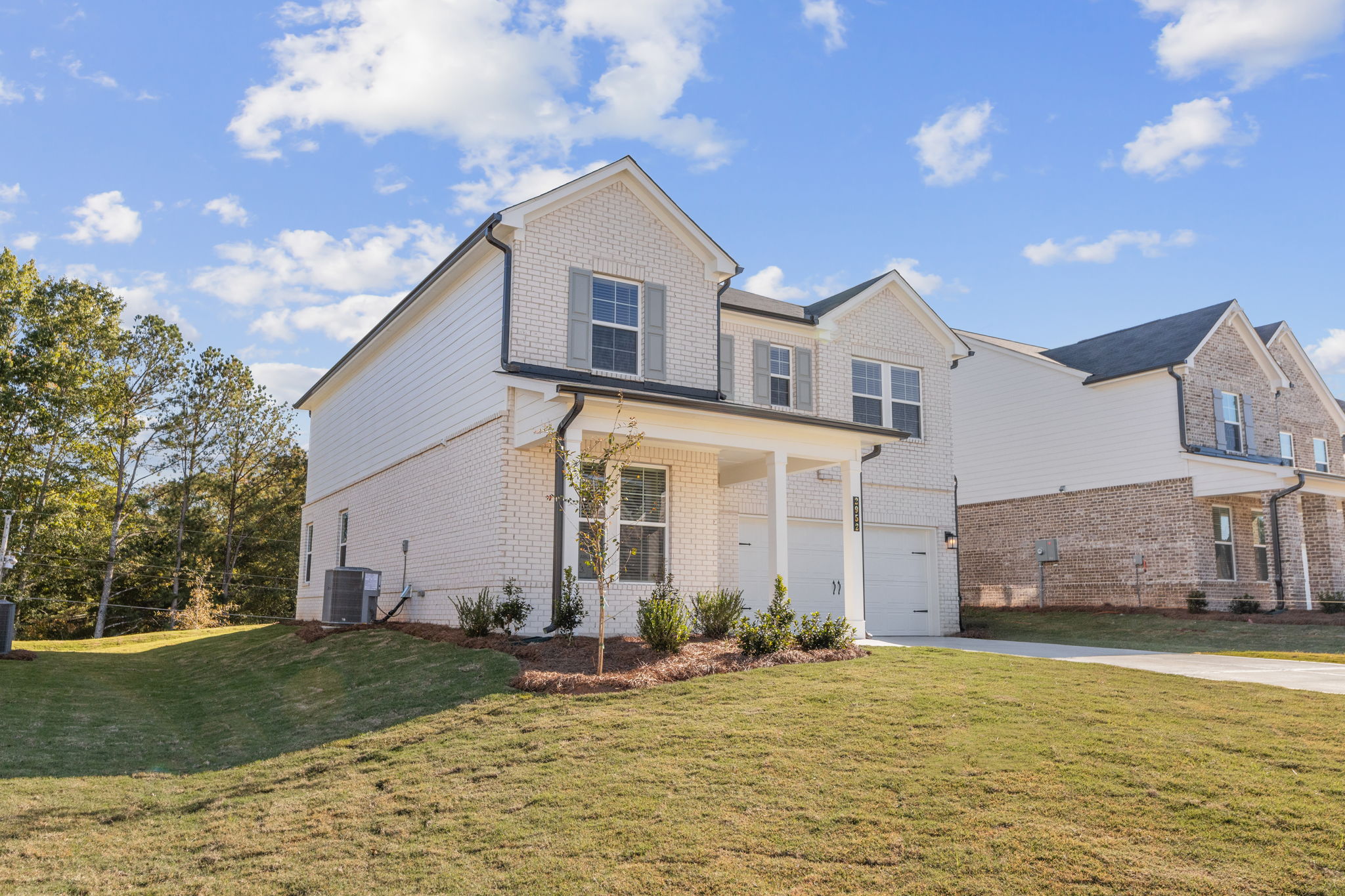 A house with a lawn and trees.