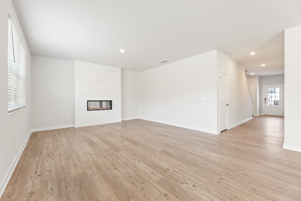 A room with a wood floor and a wood floor.