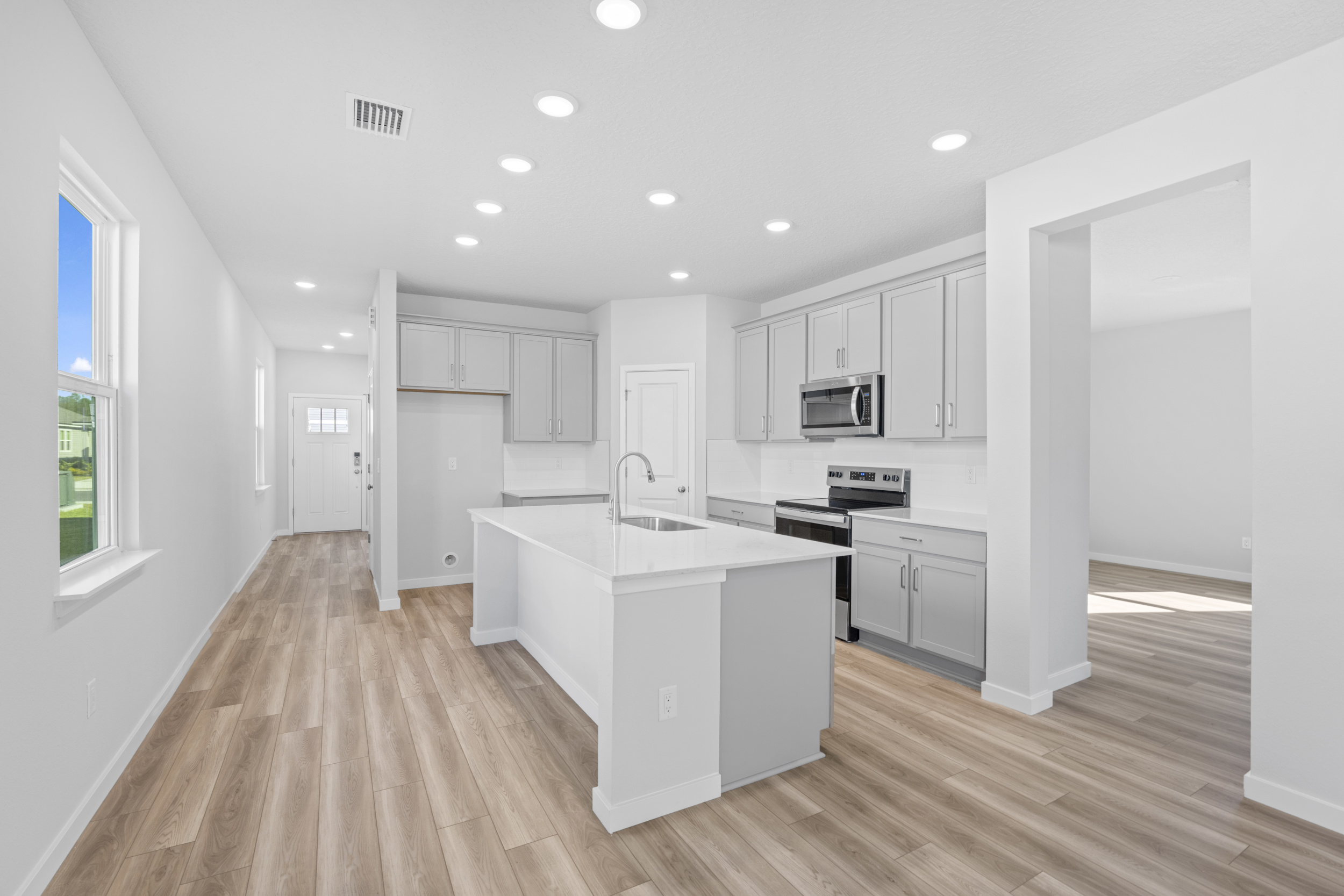 Lot 23 Kitchen with Gray Cabinets at Camden Woods in Kingsland