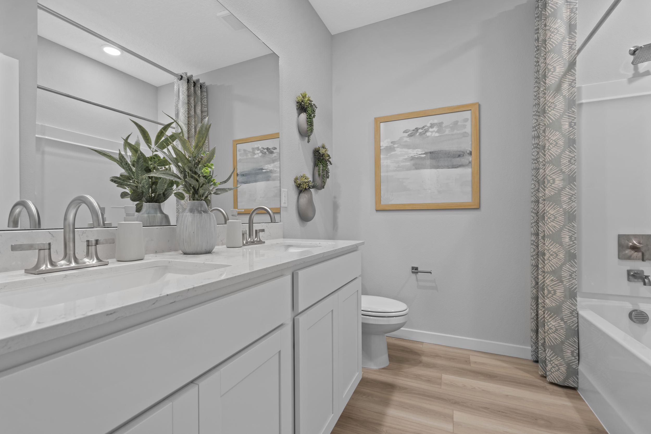 Coronado Model Home Guest Bathroom with Tub and Shower at Reserve East in Flagler Beach