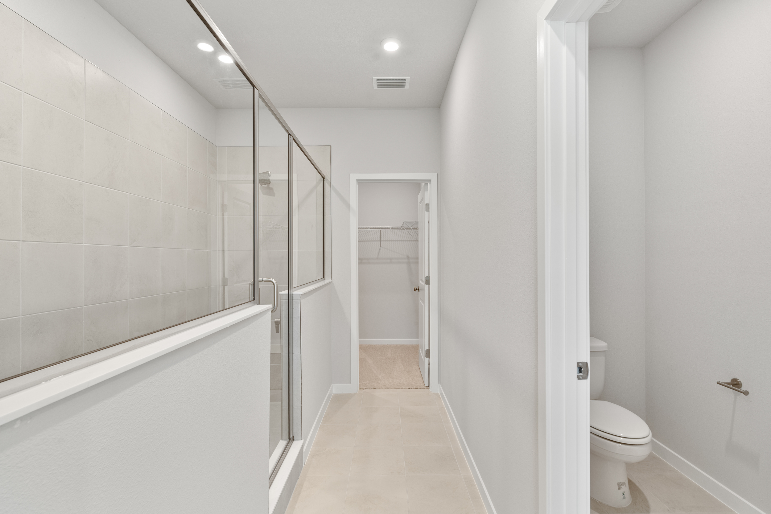 Lot 67 Primary Bathroom Super Shower and Walk-In Closet at Seminole Palms