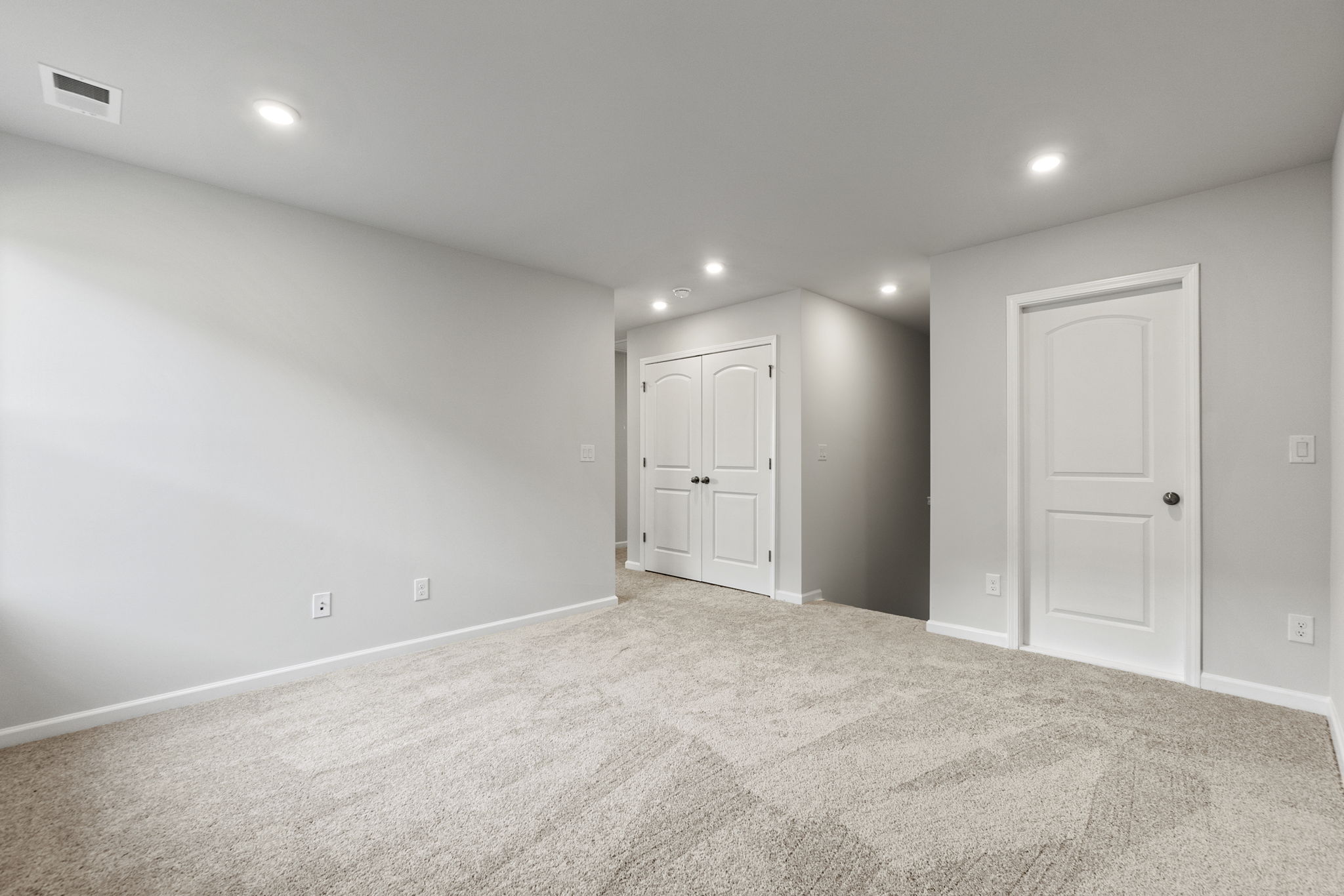 A room with white doors.