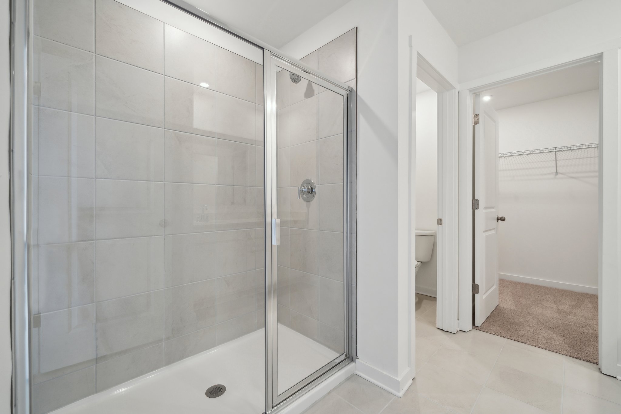 A bathroom with a glass shower.