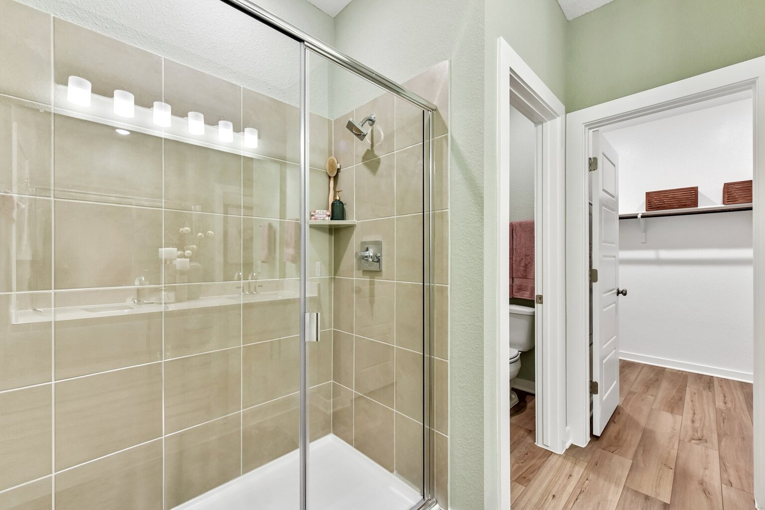 A bathroom with a glass shower.