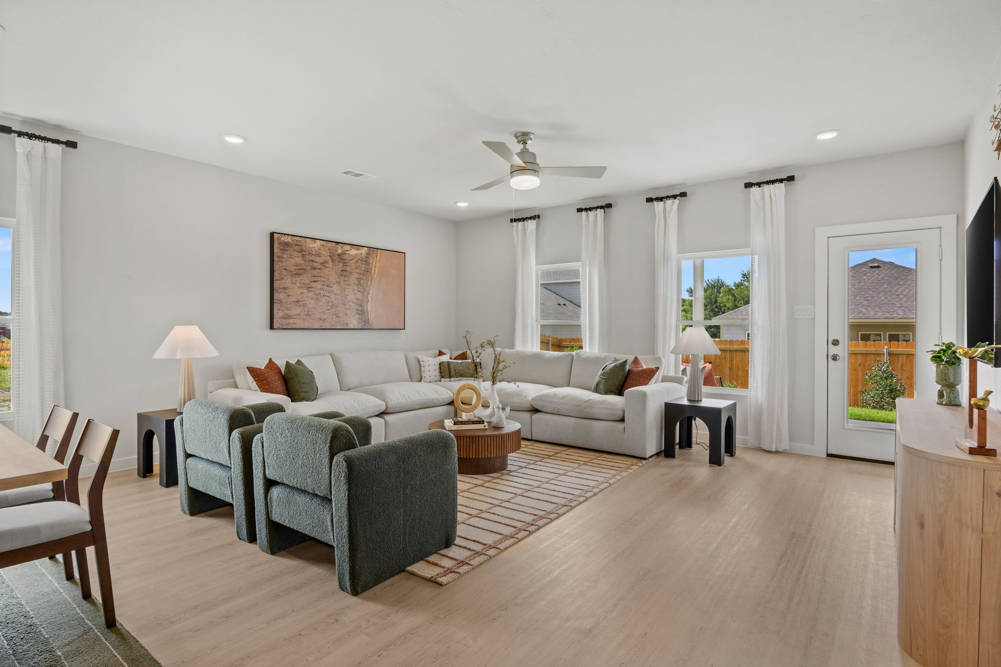 A living room with a wood floor.
