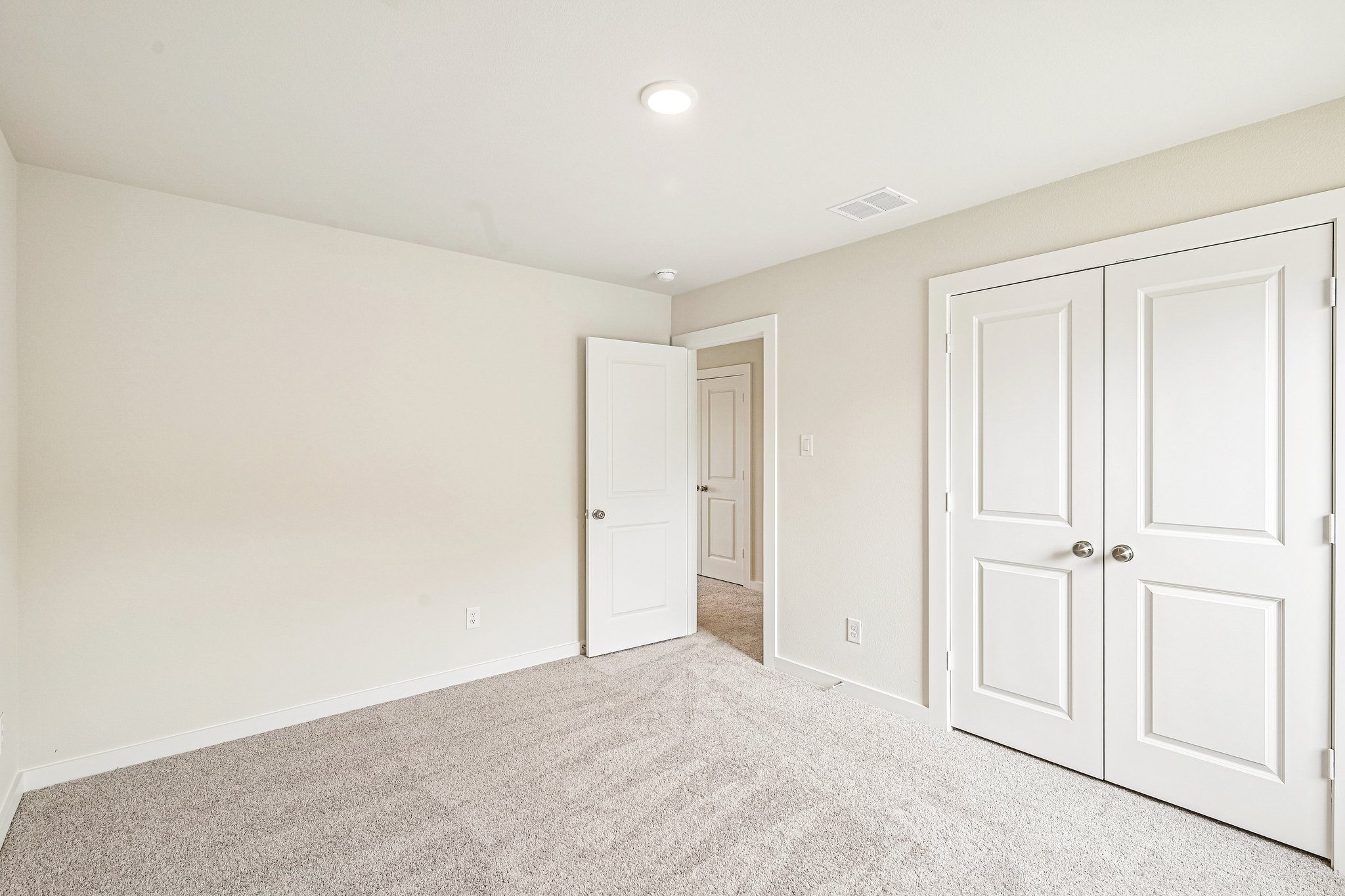 A room with white doors.
