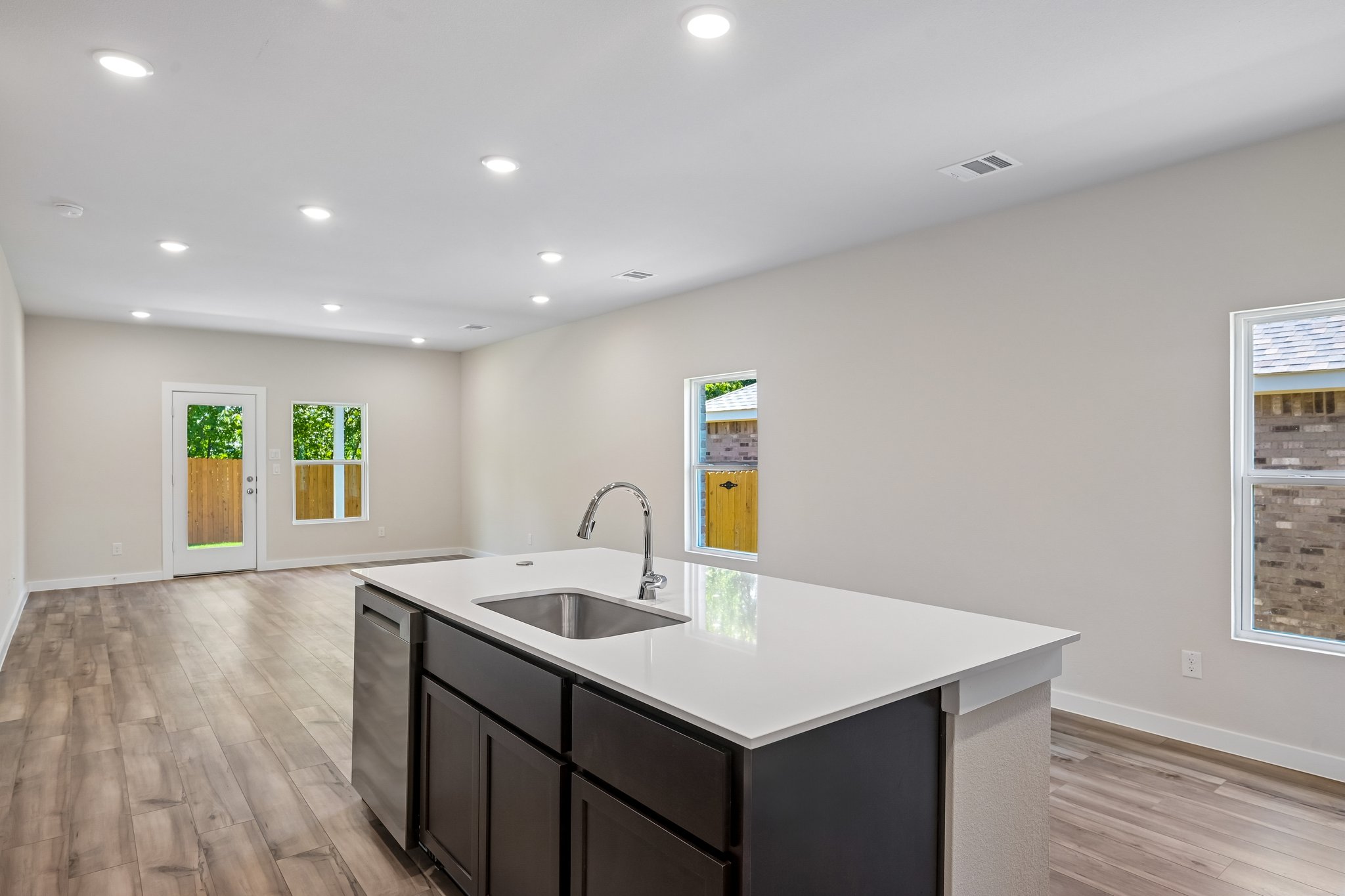 A kitchen with a sink and cabinets.