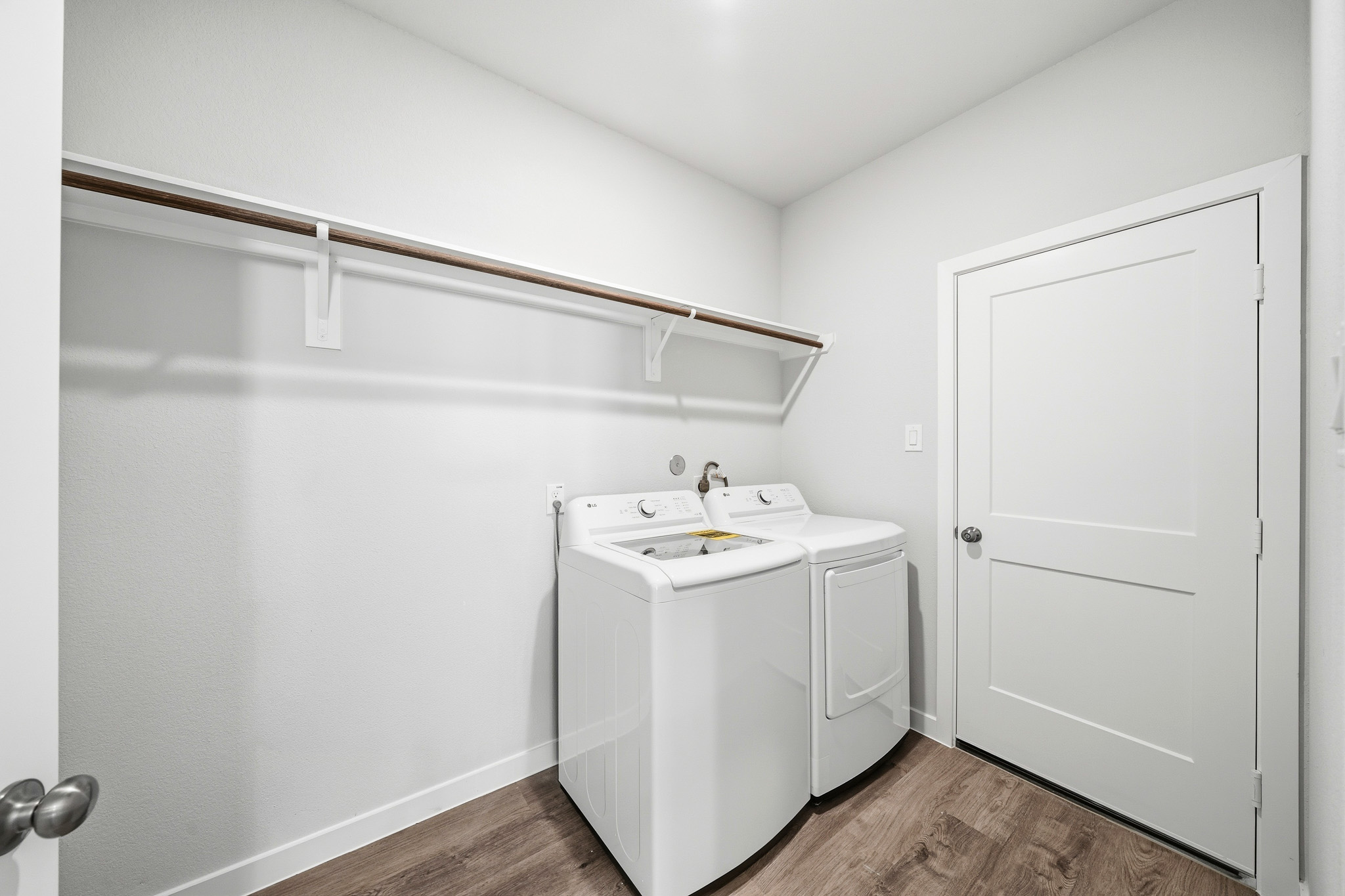 A white washer and dryer in a room.