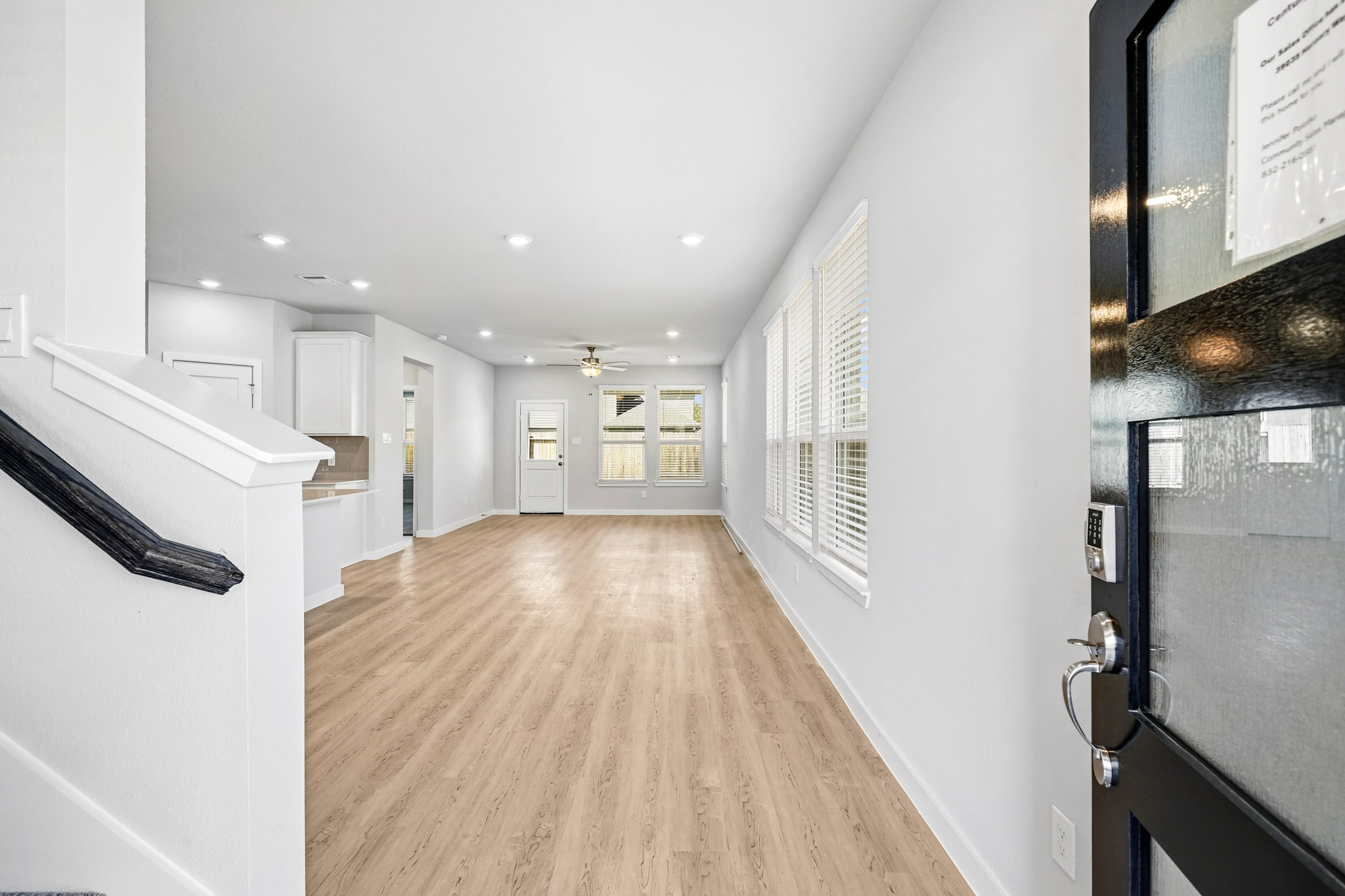 A long hallway with white walls.