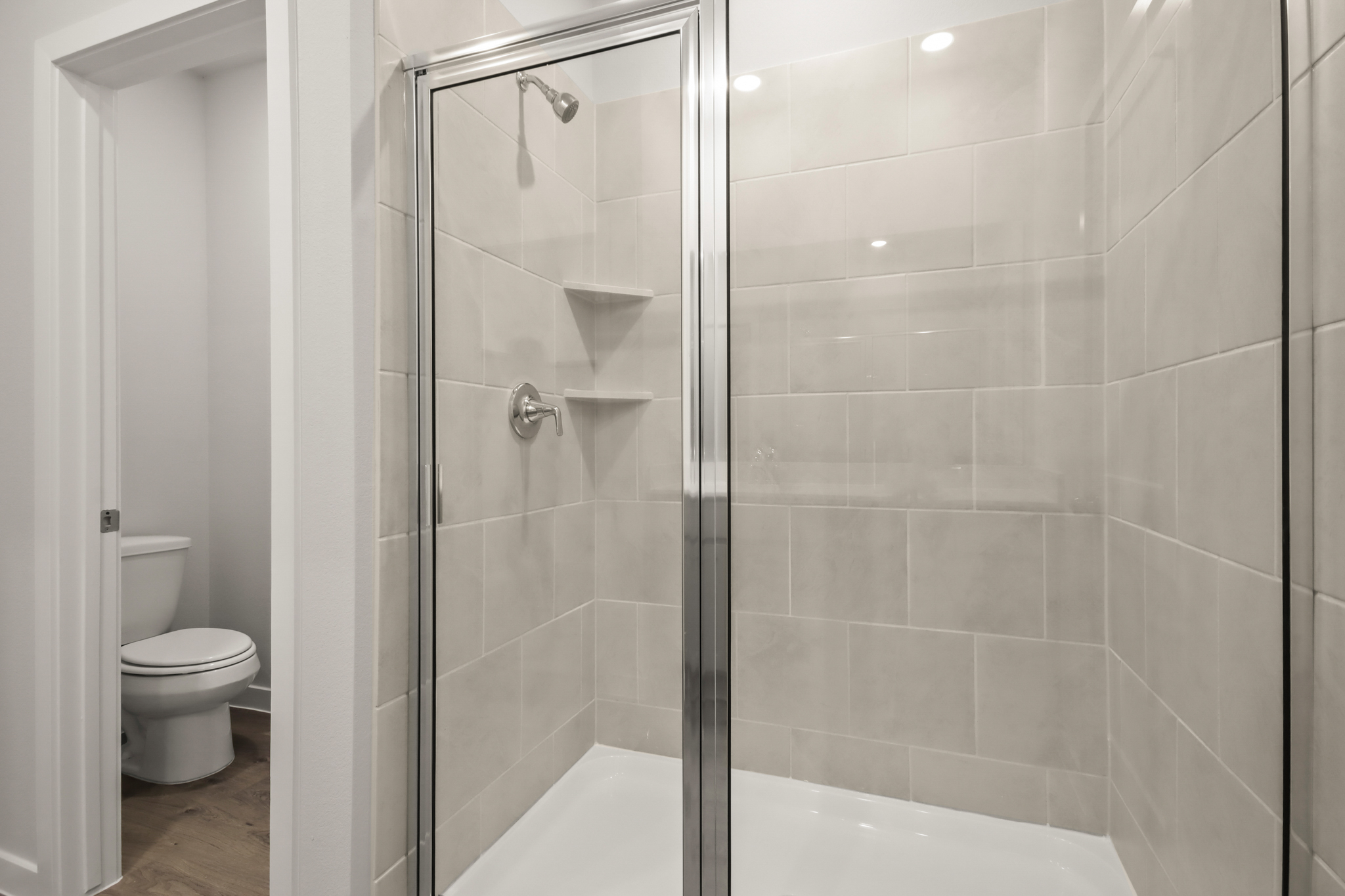 A bathroom with a glass shower.