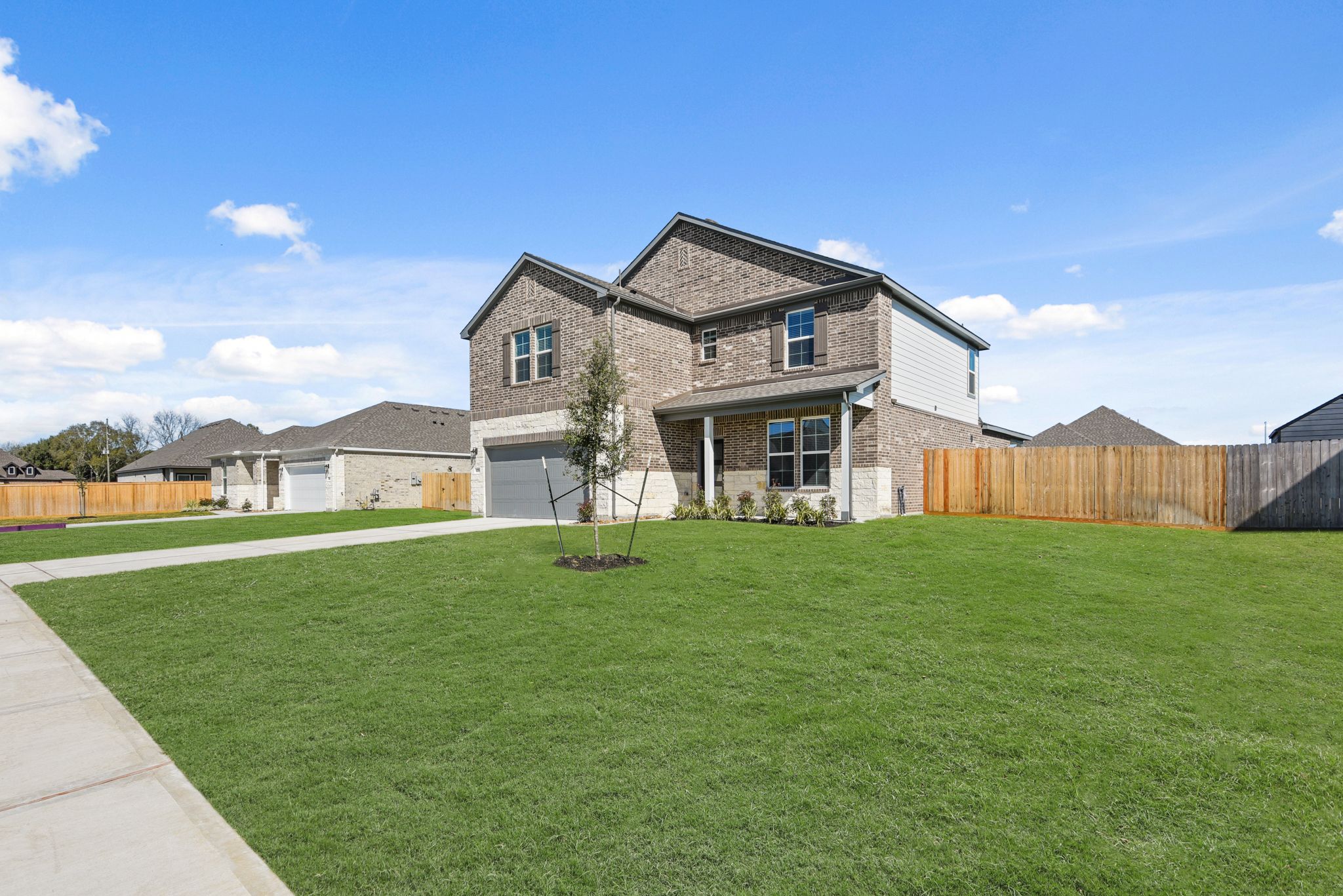 A large house with a lawn.