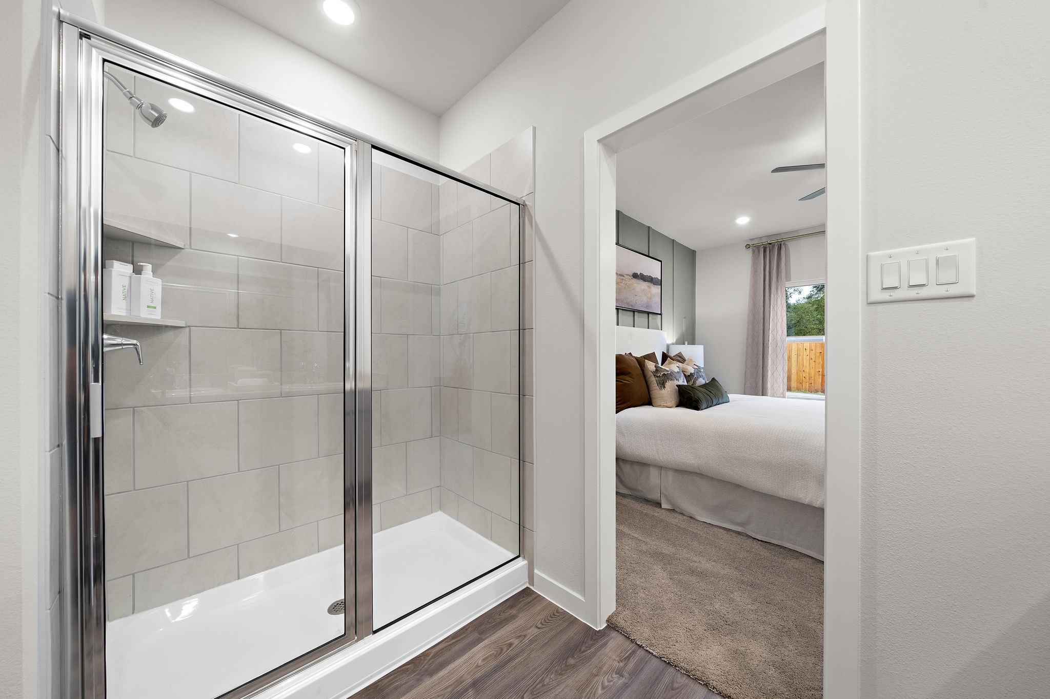 A bathroom with a glass shower.