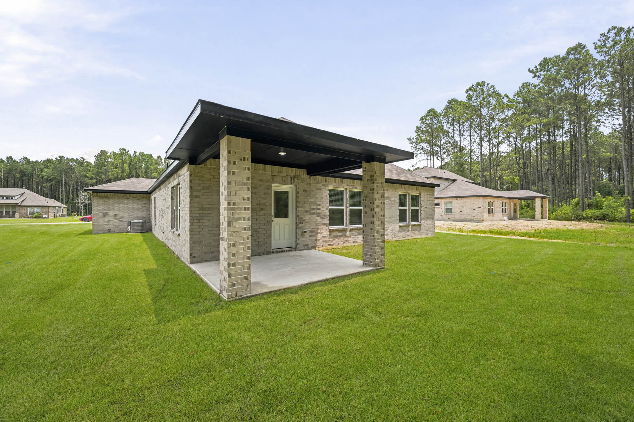 A house with a grass yard.