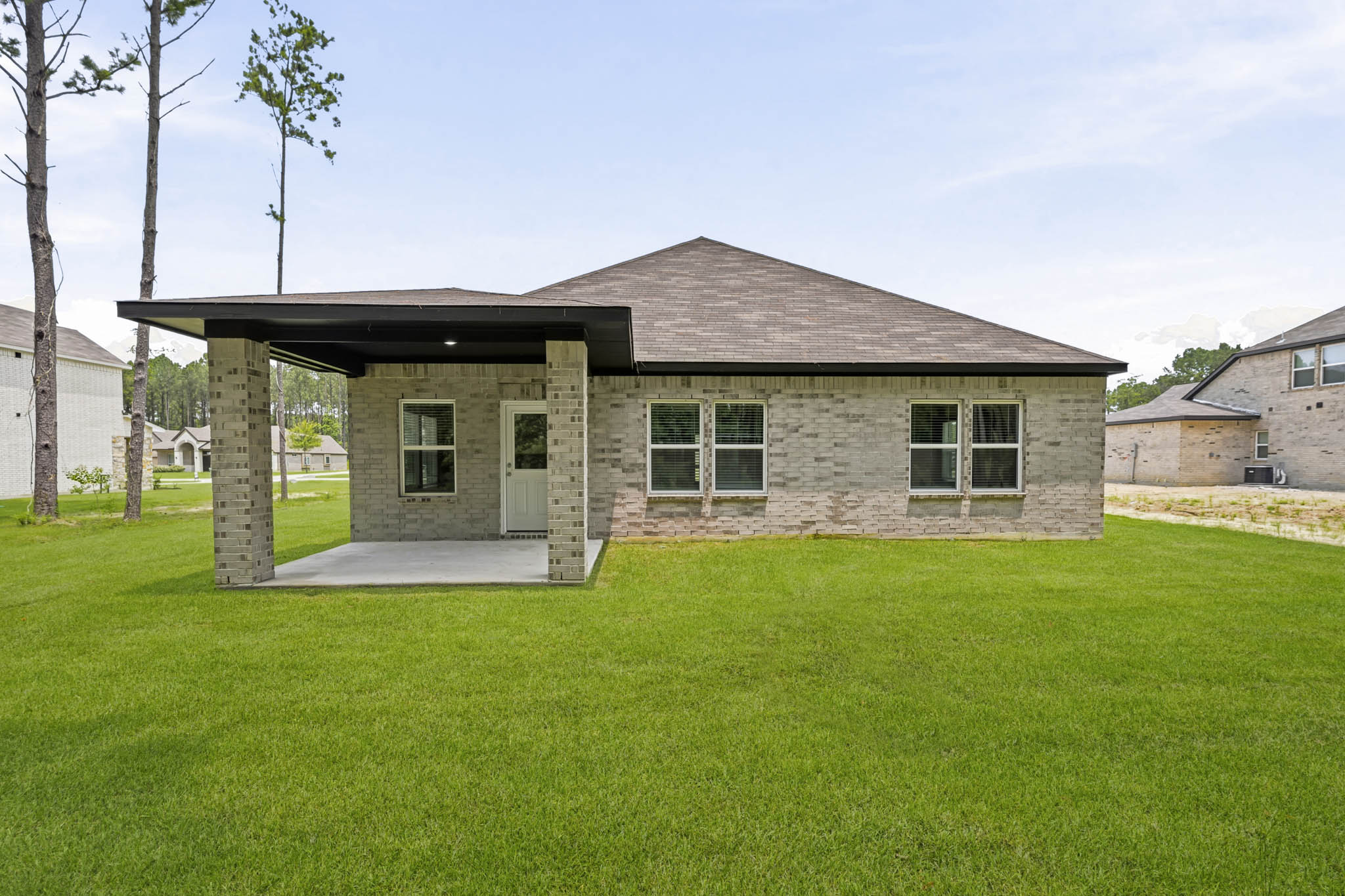 A house with a grass yard.