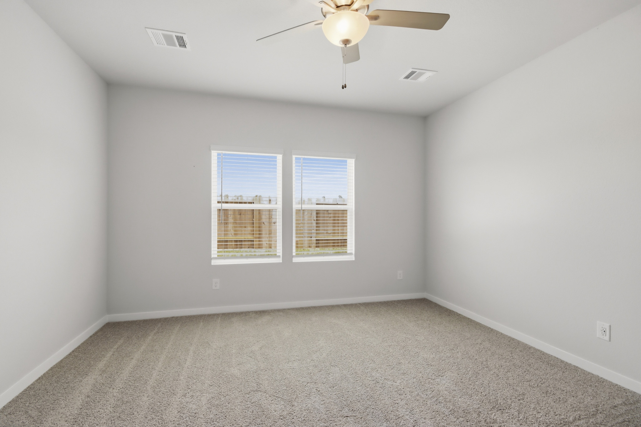 A room with a ceiling fan and a ceiling fan.