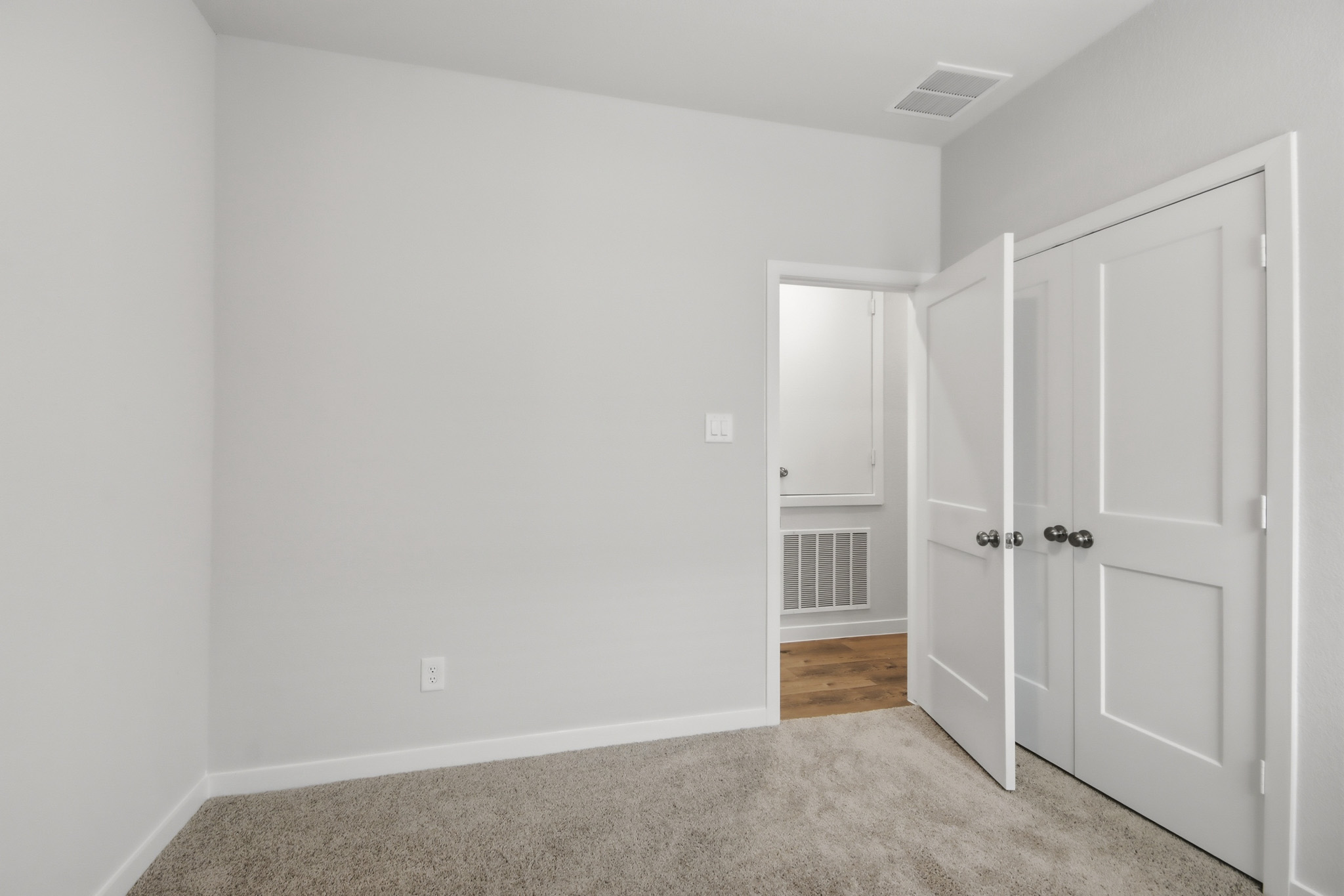 A room with white doors.