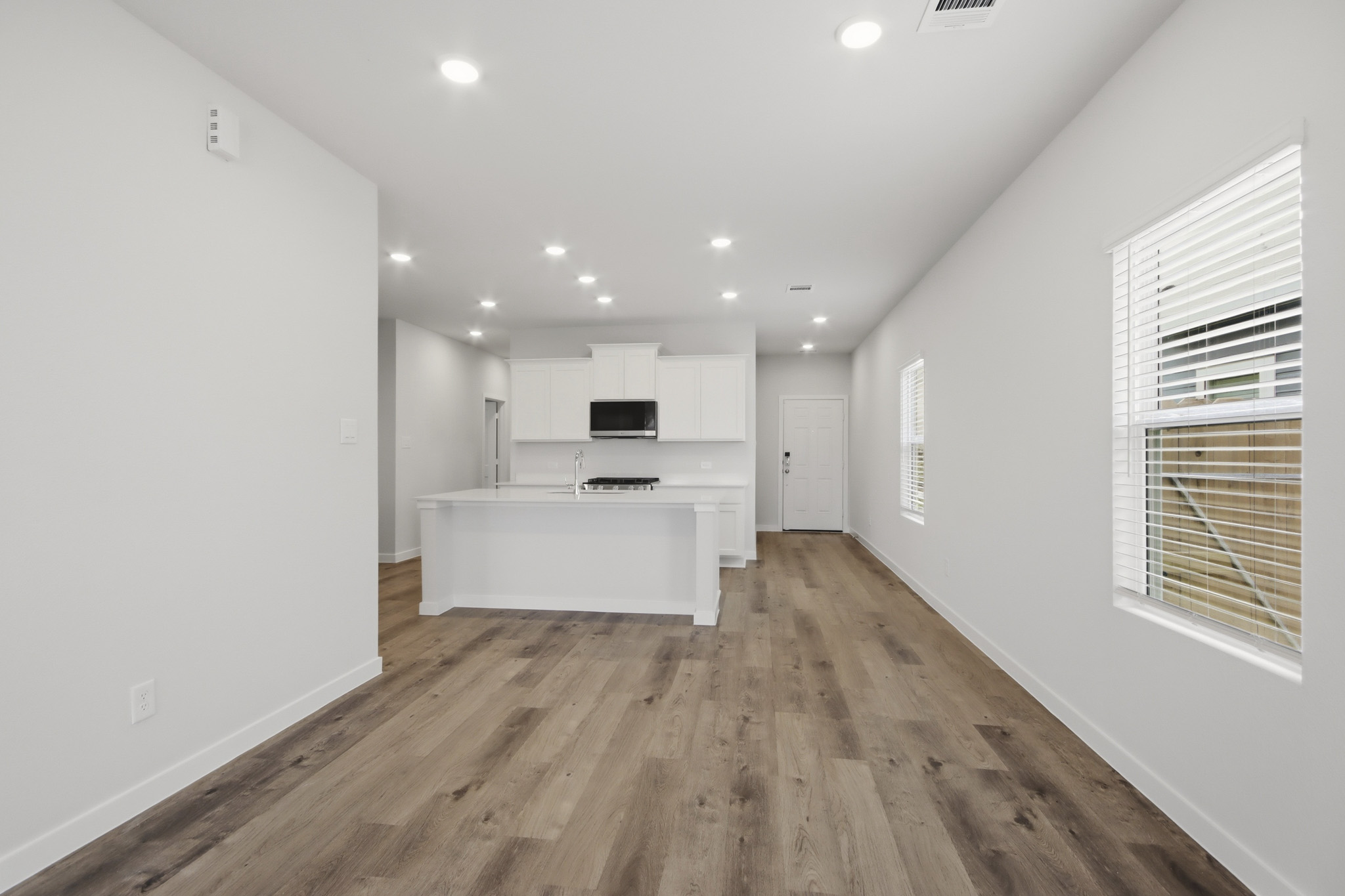 A kitchen with white walls.