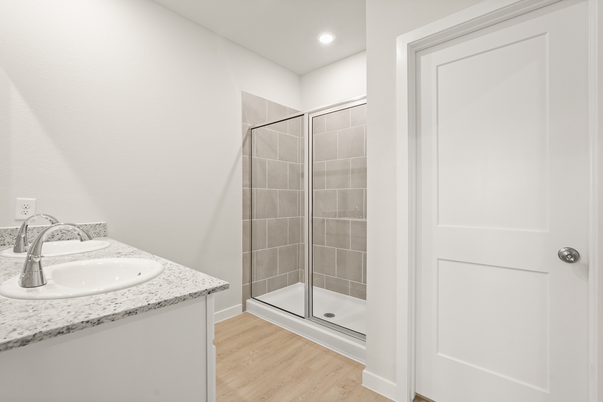 A bathroom with a glass shower.