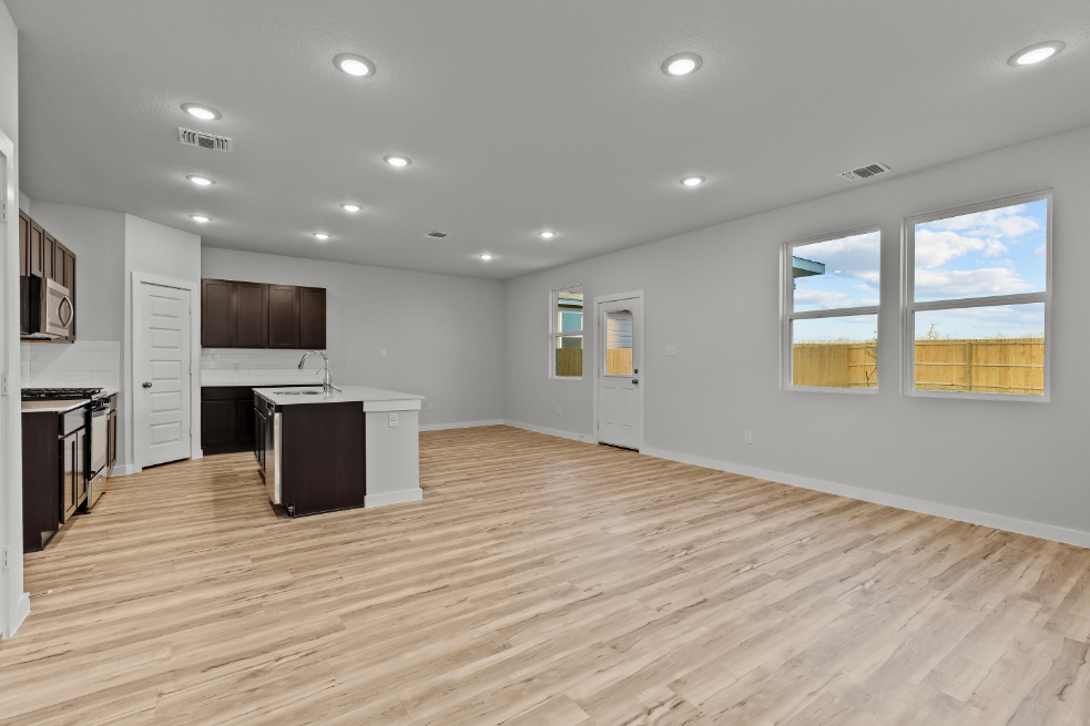 A large kitchen with white cabinets.