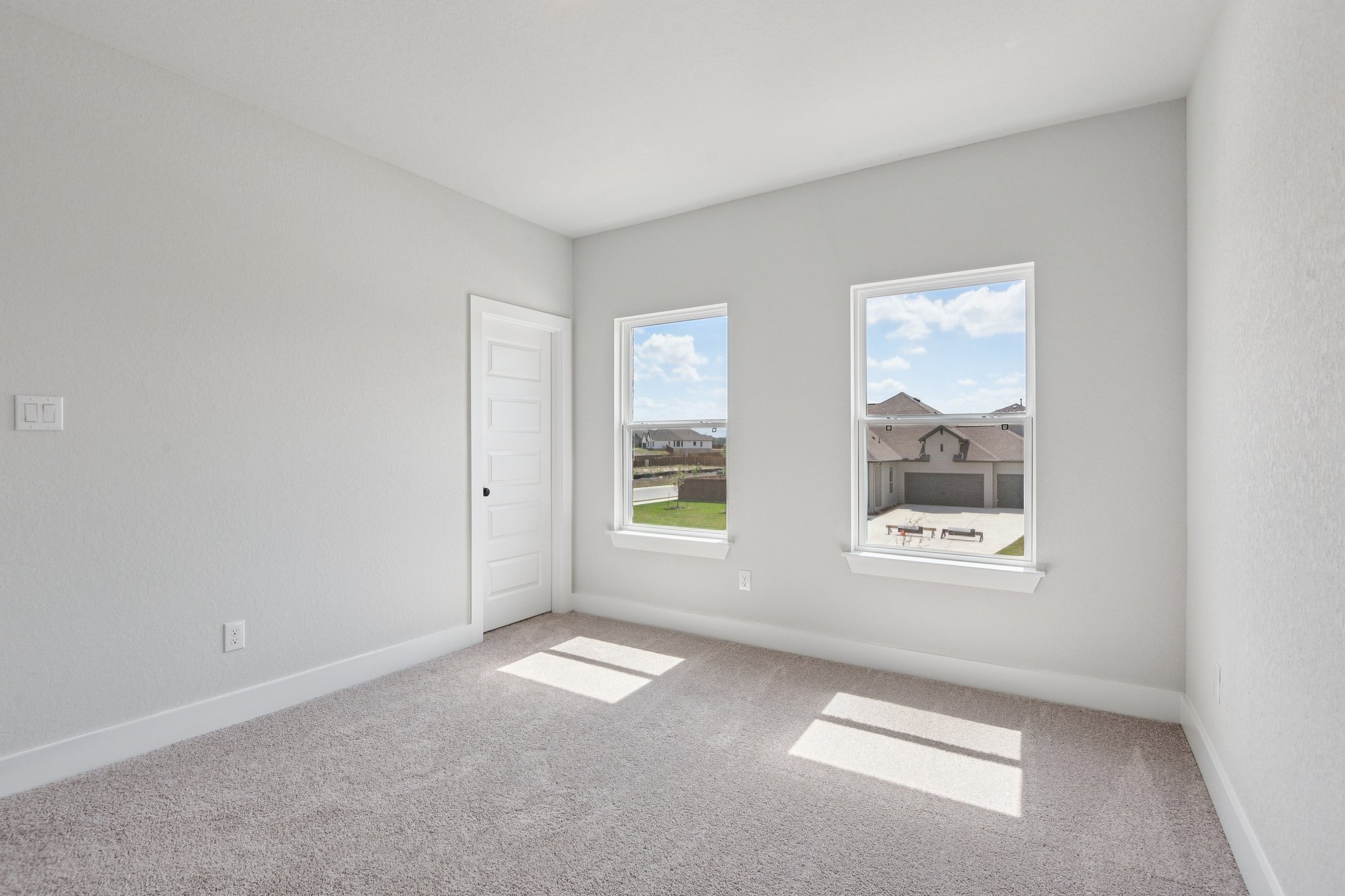 A room with a large window.