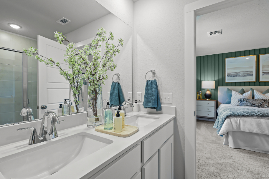 A bathroom with a large mirror.