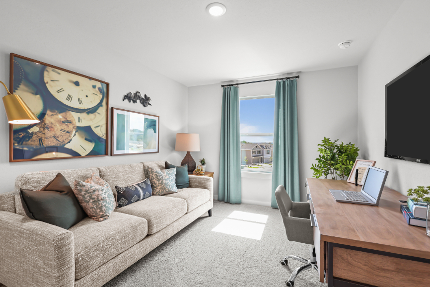 A living room with a couch and a table.