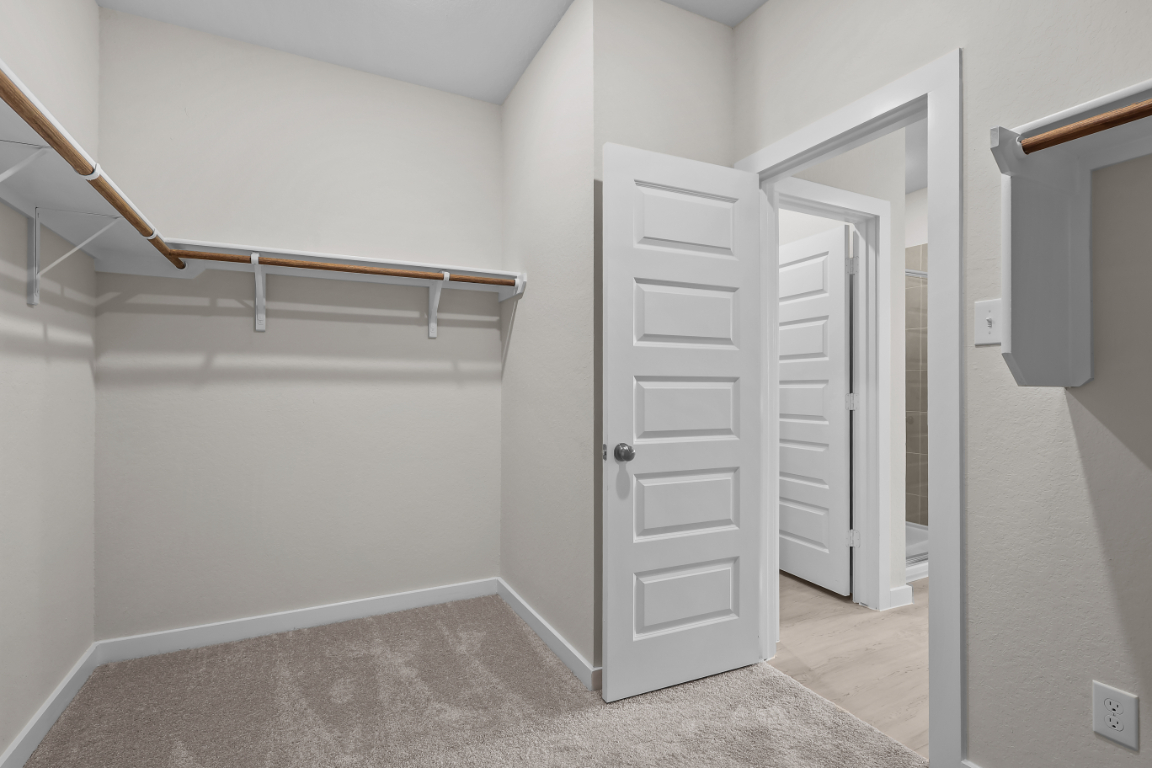 A white room with white doors.