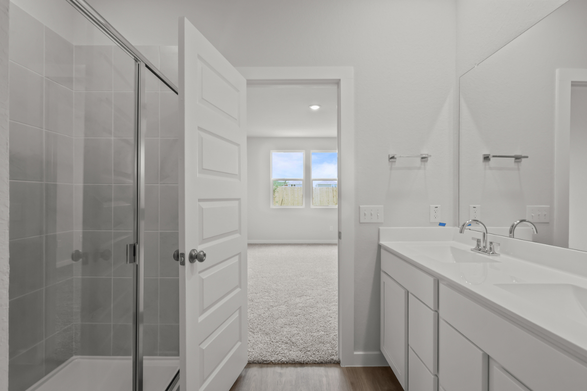 A bathroom with a glass shower.
