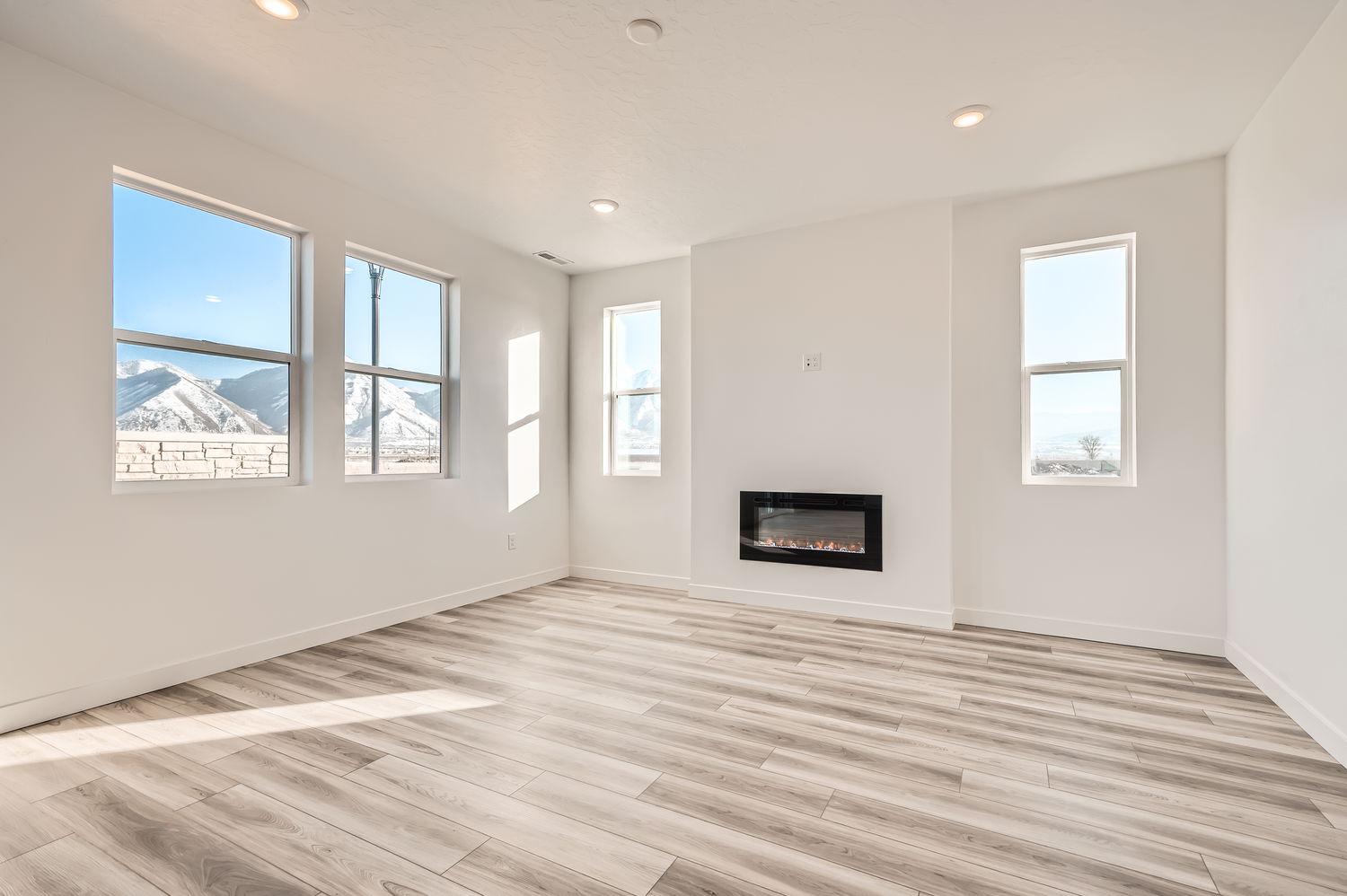 A room with a fireplace and a tv.