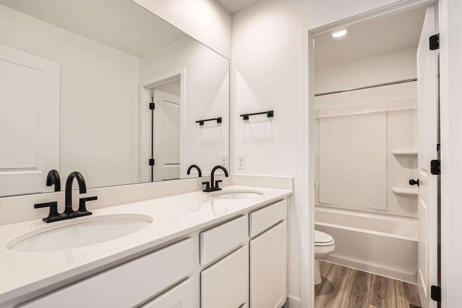 A bathroom with a sink and a toilet.