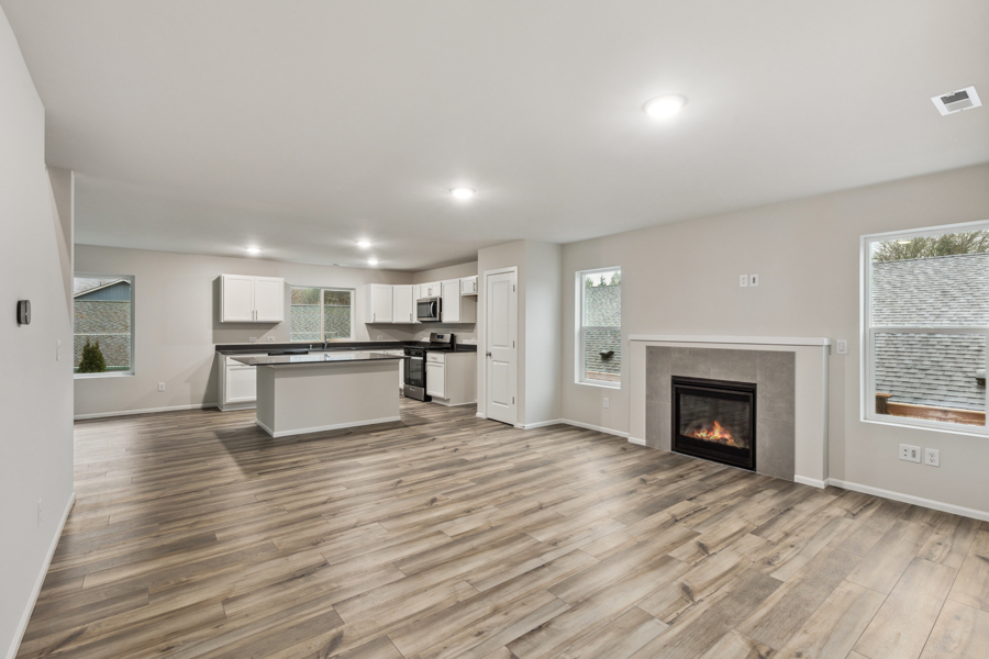 A large kitchen with a fireplace.