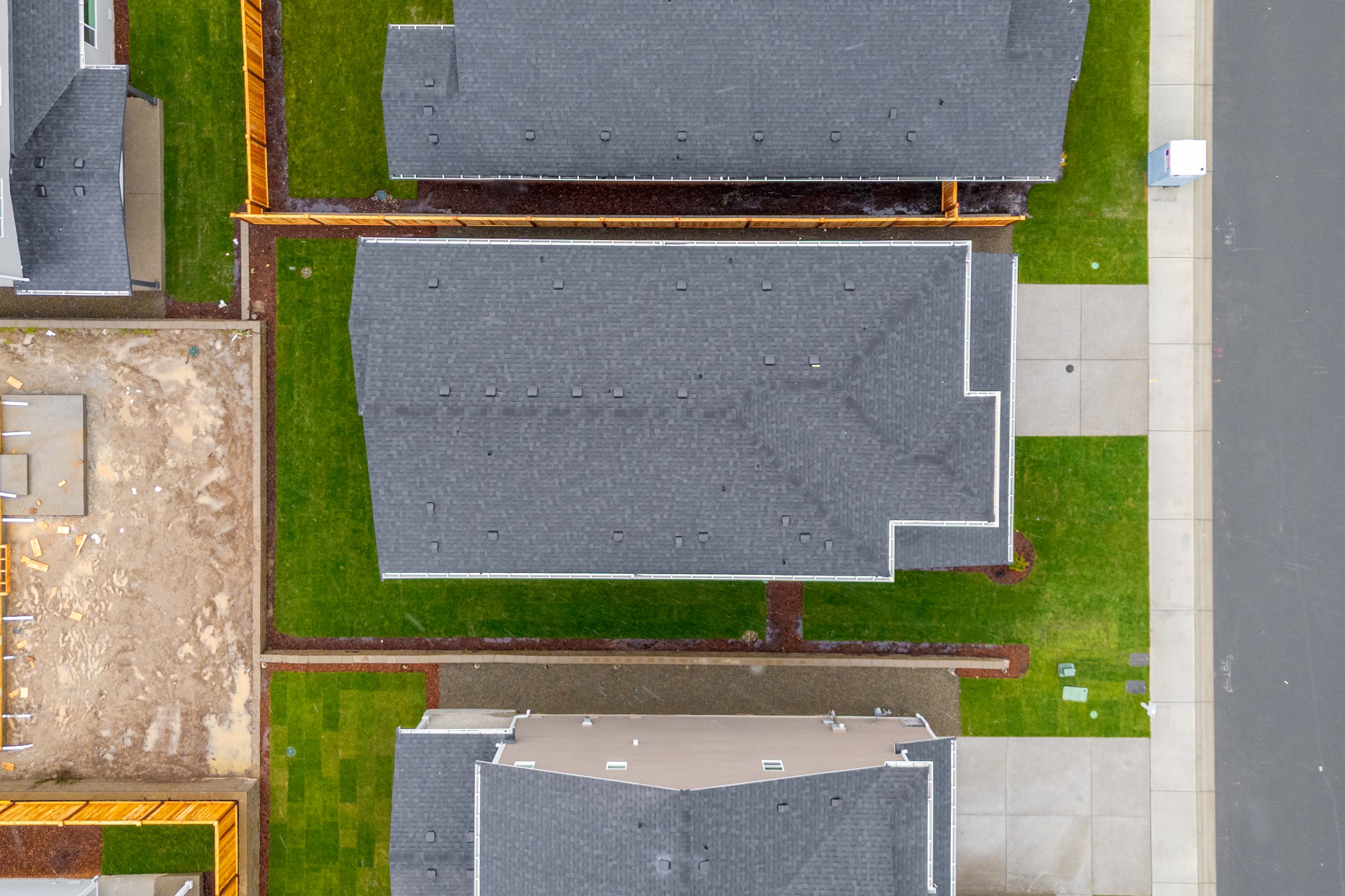 A building with a green field.
