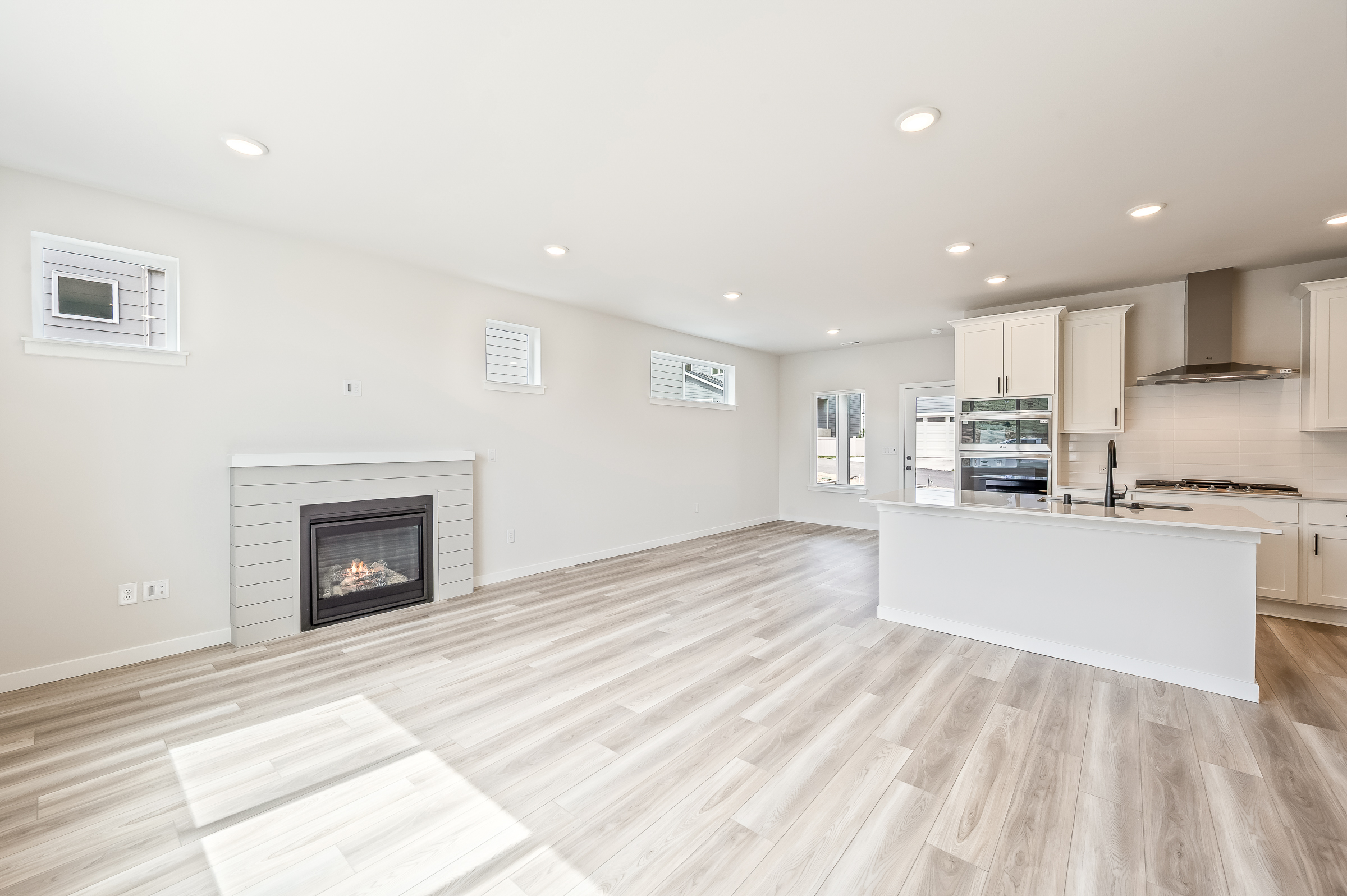 A large kitchen with a fireplace.