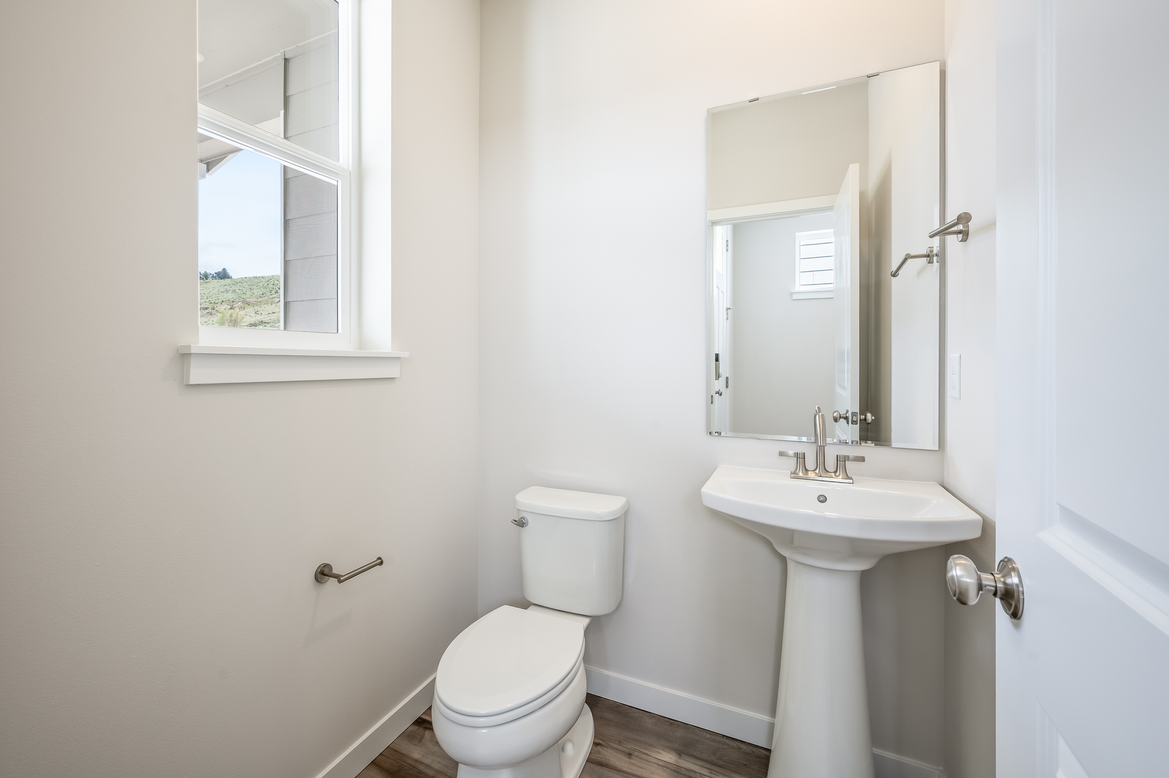 A bathroom with a toilet and sink.
