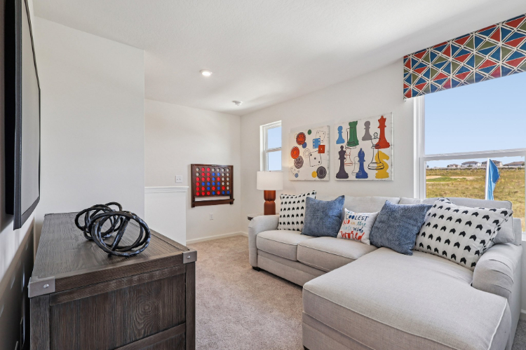 A living room with a couch and a table.