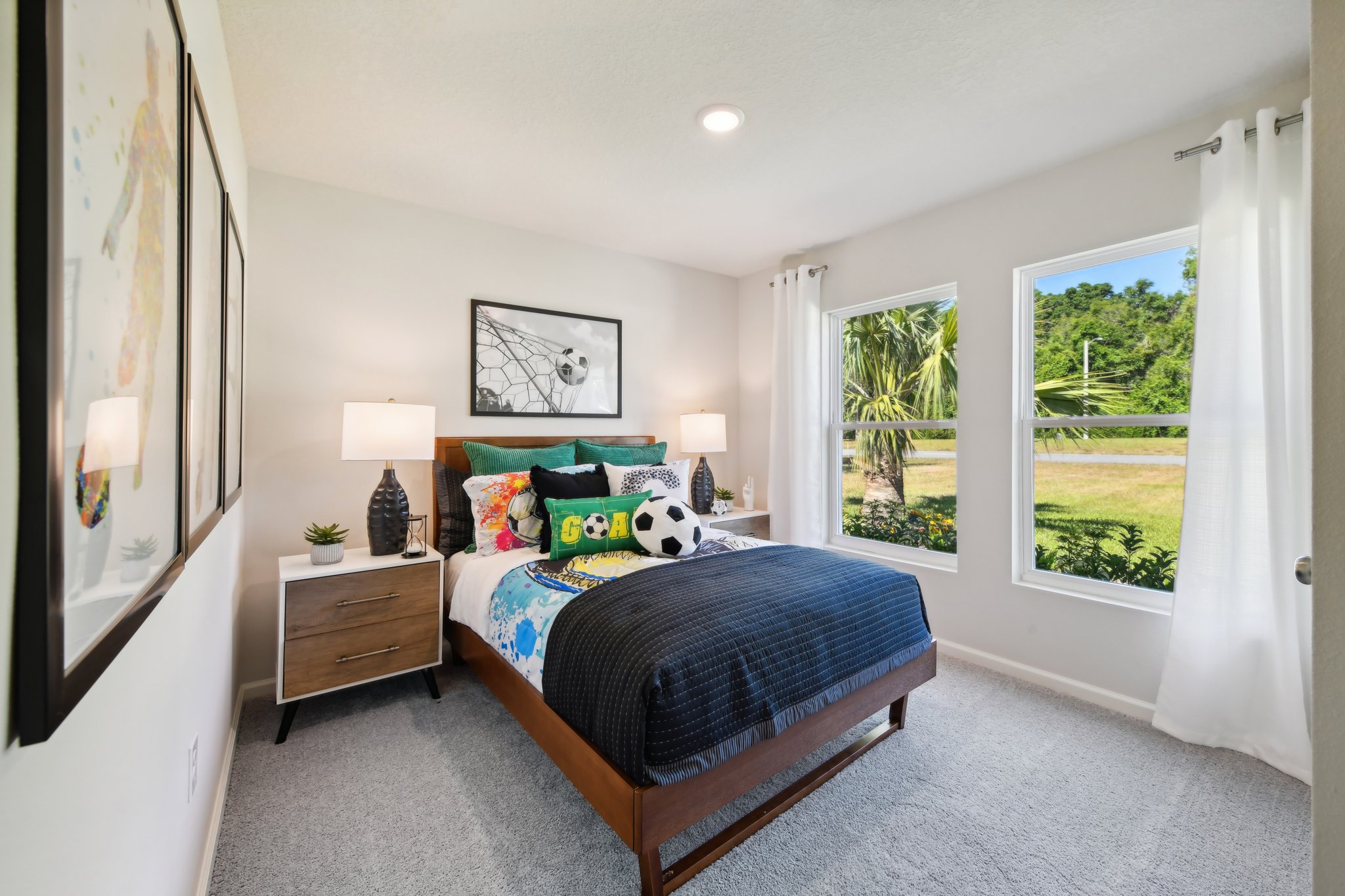 A bedroom with a bed and a window.