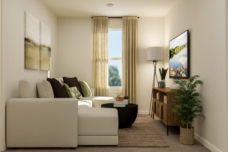A living room with a white couch and a coffee table.